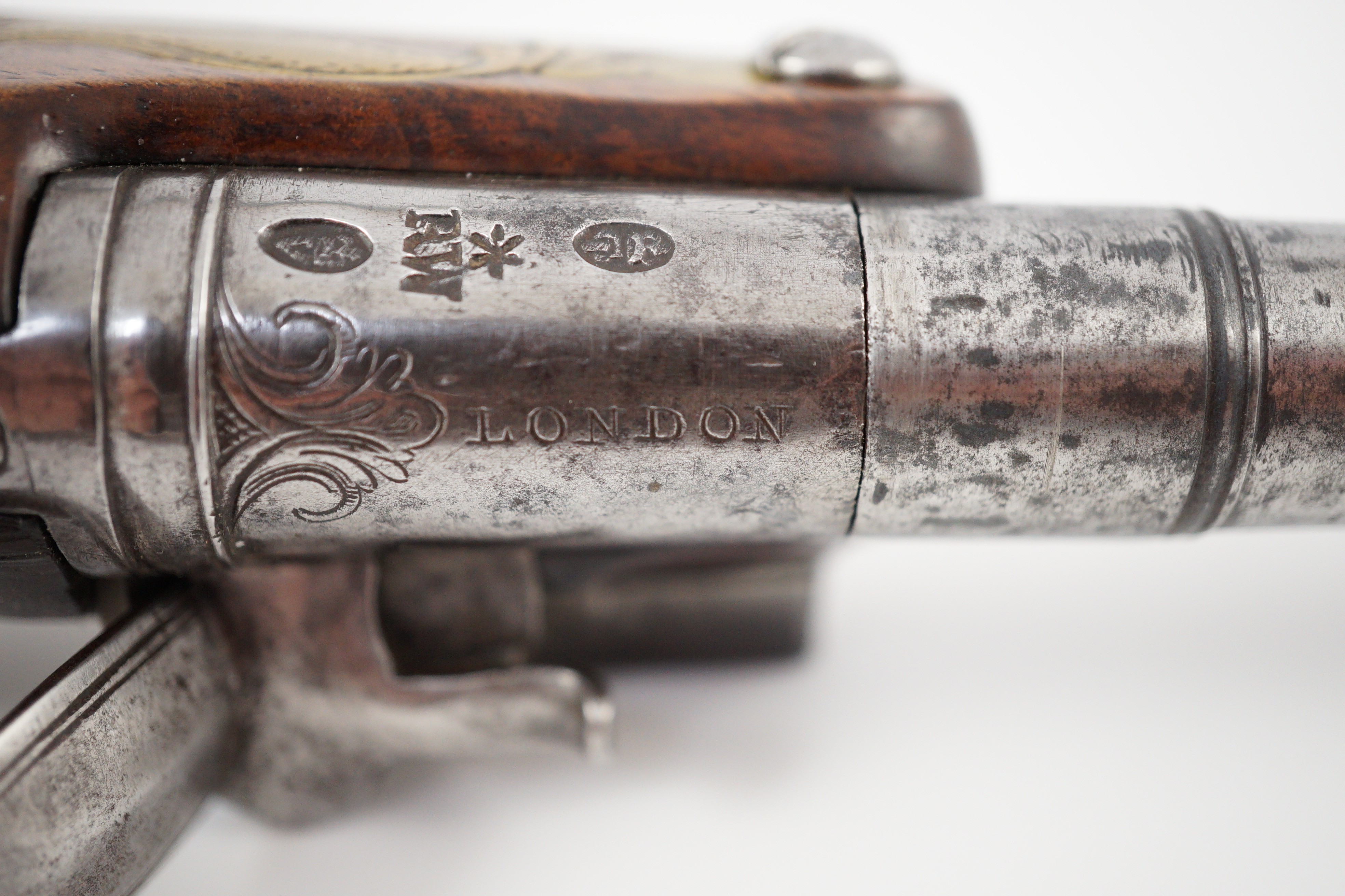 Wilson of London. An early 18th century flintlock pocket pistol, 11cm high 19cm long